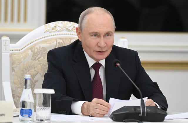 In this pool photograph distributed by the Russian state agency Sputnik, Russia's President Vladimir Putin attends a meeting with Kyrgyzstan's President on the sidelines of the Shanghai Cooperation Organisation (SCO) summit in Bishkek on September 1, 2026. (Photo by Kristina Solovyova / POOL / AFP)