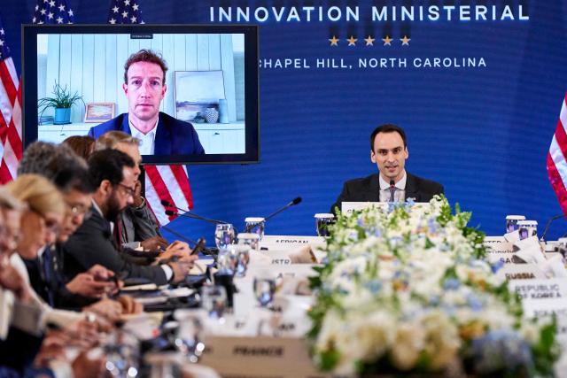 Meta CEO Mark Zuckerberg (L) is displayed on a screen as White House Office of Science and Technology Policy Director Michael Kratsios speaks during the G20 Innovation Ministerial meeting in Chapel Hill, North Carolina, on September 1, 2026. (Photo by Matt RAMEY / AFP)
