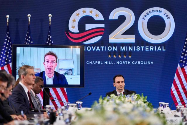 Meta CEO Mark Zuckerberg, displayed on a screen, speaks as White House Office of Science and Technology Policy Director Michael Kratsios hosts the G20 Innovation Ministerial meeting in Chapel Hill, North Carolina, on September 1, 2026. (Photo by Matt RAMEY / AFP)