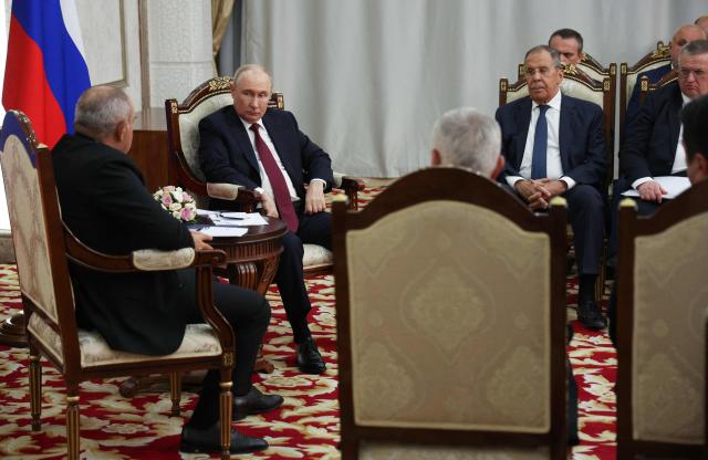 In this pool photograph distributed by the Russian state agency Sputnik, Russia's President Vladimir Putin and Armenian Prime Minister Nikol Pashinyan hold a meeting on the sidelines of the Shanghai Cooperation Organisation (SCO) summit in Bishkek on September 1, 2026. (Photo by Vyacheslav PROKOFYEV / POOL / AFP)