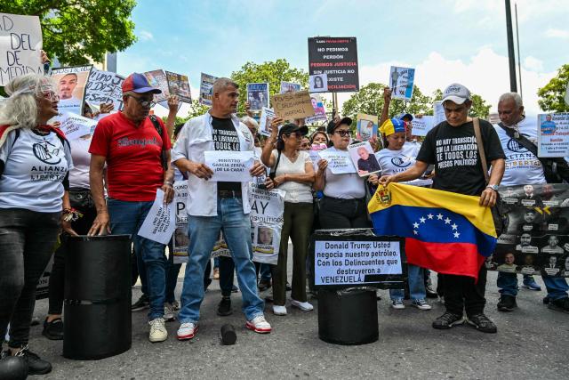 Relatives of political prisoners take part in the "How Much Oil Do Our Prisoners Cost?" march outside the Ministry of Prisons in Caracas on September 1, 2026. Relatives of political prisoners demonstrate in Caracas on September 1, calling on Washington over the failure to secure the release of their detained loved ones, as a major oil agreement between the United States and Venezuela takes shape. (Photo by Juan BARRETO / AFP)
