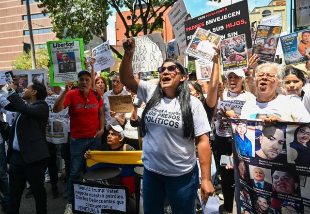 Relatives of political prisoners take part in the "How Much Oil Do Our Prisoners Cost?" march outside the Ministry of Prisons in Caracas on September 1, 2026. Relatives of political prisoners demonstrate in Caracas on September 1, calling on Washington over the failure to secure the release of their detained loved ones, as a major oil agreement between the United States and Venezuela takes shape. (Photo by Juan BARRETO / AFP)