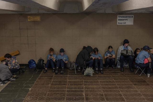 McDonald's employees take shelter in an underground passage during an air raid alert in Kyiv on September 1, 2026, amid the Russian invasion of Ukraine. (Photo by Roman PILIPEY / AFP)