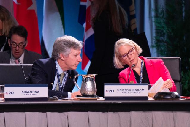 Argentina's Central Bank's President Santiago Bausili confers with UK's Chief Secretary to the Treasury Emma Reynolds at the G20 Finance Ministers and Central Bank Governors’ meeting in Asheville, North Carolina, on September 1, 2026. (Photo by Allison Joyce / AFP)
