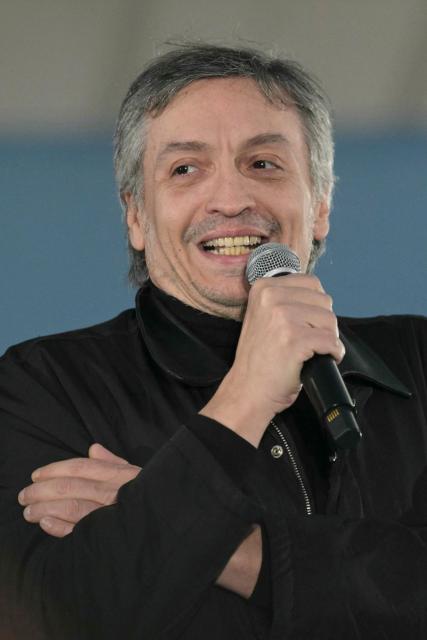 Deputy Maximo Kirchner, son of former Argentine President and Vice President Cristina Fernandez de Kirchner, delivers a speech below her house arrest in Buenos Aires on September 1, 2026, during the fourth anniversary of the failed assassination attempt against her. (Photo by JUAN MABROMATA / AFP)