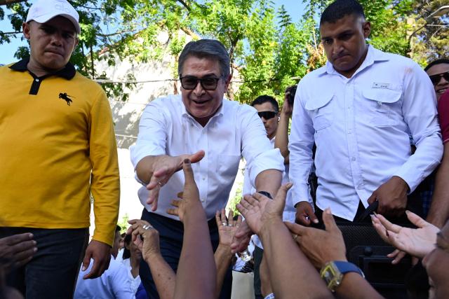 Former Honduran president Juan Orlando Hernandez (2014-2022) greets supporters outside the Supreme Court of Justice in Tegucigalpa on September 1, 2026, after a judge dismissed corruption charges against him. Honduran justice on September 1 dismissed corruption charges against former president Juan Orlando Hernandez, who had previously been pardoned by US President Donald Trump following a drug trafficking conviction in the United States, the judiciary said. (Photo by Orlando SIERRA / AFP)