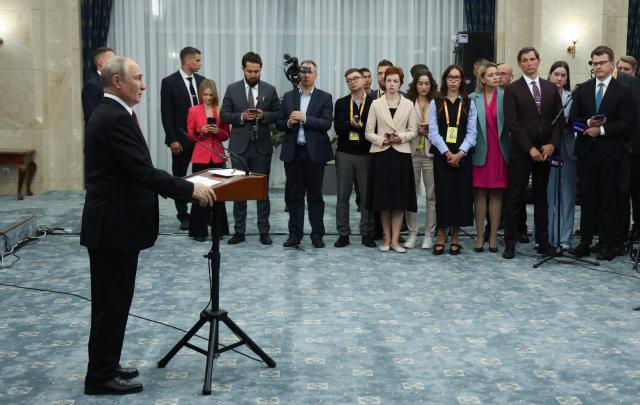 In this pool photograph distributed by the Russian state agency Sputnik, Russia's President Vladimir Putin meets with the media after the Shanghai Cooperation Organisation (SCO) summit in Bishkek on September 1, 2026. (Photo by Vyacheslav PROKOFYEV / POOL / AFP)