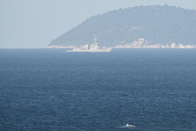 US Navy Arleigh Burke-class guided-missile destroyer USS Frank E. Petersen Jr. (DDG-121) (top) is seen off Laem Chabang Port in the Gulf of Thailand early on September 2, 2026. (Photo by ANTHONY WALLACE / AFP)