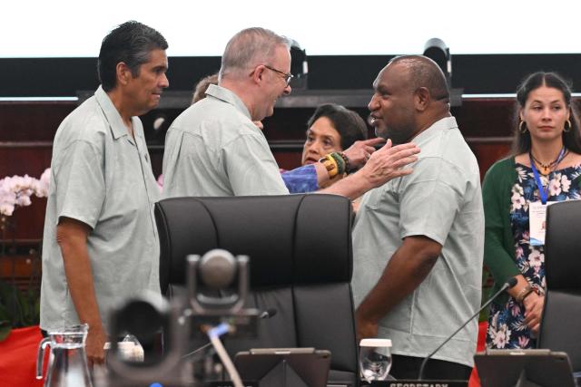 Australian Prime Minister Anthony Albanese (C) meets Papua New Guinea Prime Minister James Marape (R) as Palau President Surangel Samuel Whipps Jr. (L) looks on during Pacific Islands Forum Leaders’ plenary meeting in Koror on September 2, 2026. (Photo by SAEED KHAN / AFP)