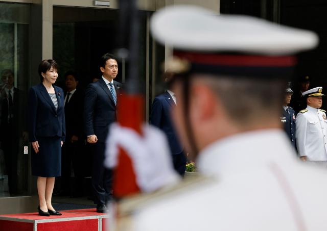 Japan's Prime Minister Sanae Takaichi and Defence Minister Shinjiro Koizumi attend an honour guard inspection ceremony at the Self-Defense Forces Senior Commanders' Conference in Tokyo on September 2, 2026. (Photo by Kim Kyung-Hoon / POOL / AFP)