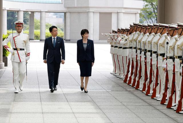 Japan's Prime Minister Sanae Takaichi and Defence Minister Shinjiro Koizumi inspect an honour guard at the Self-Defense Forces Senior Commanders' Conference in Tokyo on September 2, 2026. (Photo by Kim Kyung-Hoon / POOL / AFP)