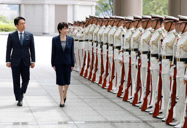 Japan's Prime Minister Sanae Takaichi and Defence Minister Shinjiro Koizumi inspect an honour guard at the Self-Defense Forces Senior Commanders' Conference in Tokyo on September 2, 2026. (Photo by Kim Kyung-Hoon / POOL / AFP)