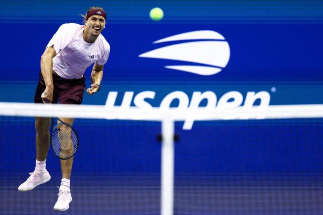 Germany's Alexander Zverev serves the ball to Italy's Lorenzo Sonego during the men's singles first round tennis match on day three of the US Open tennis tournament at the USTA Billie Jean King National Tennis Center in New York City on September 1, 2026. (Photo by CHARLY TRIBALLEAU / AFP)