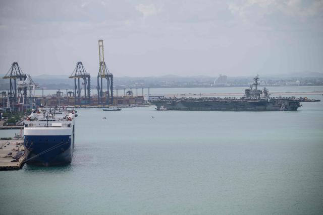 US nuclear-powered aircraft carrier USS Abraham Lincoln (CVN-72) (R) prepares to dock at Laem Chabang Port, near the city of Pattaya on September 2, 2026. (Photo by ANTHONY WALLACE / AFP)