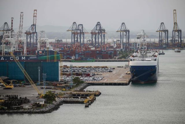Cargo containers and vehicles awaiting export are seen at Laem Chabang Port, near the city of Pattaya on September 2, 2026. (Photo by ANTHONY WALLACE / AFP)