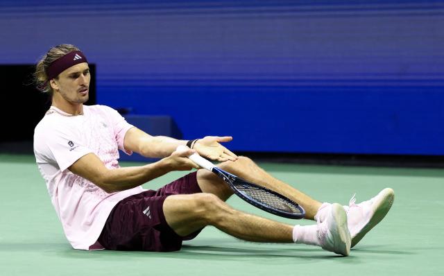 Germany's Alexander Zverev complains about his shoes after falling during the men's singles first-round tennis match against Italy's Lorenzo Sonego on day three of the US Open tennis tournament at the USTA Billie Jean King National Tennis Center in New York City on September 1, 2026. (Photo by CHARLY TRIBALLEAU / AFP)