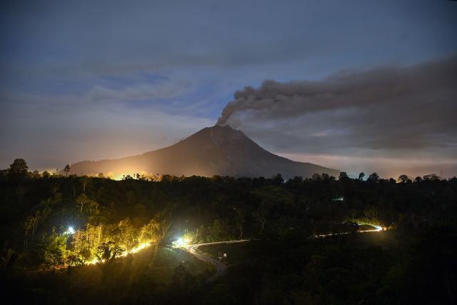 Mount Sinabung spews ash and thick smoke as seen from Karo, North Sumatra province early on September 2, 2026. (Photo by ARIANDI / AFP)