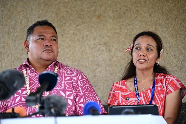 Tuvalu Minister for Home Affairs, Climate Change and Environment Maina Talia (L) and Marshall Islands Climate Envoy Tina Stege attend a press conference on climate change following the Pacific Islands Forum Leaders' plenary meeting in Koror on September 2, 2026. (Photo by SAEED KHAN / AFP)