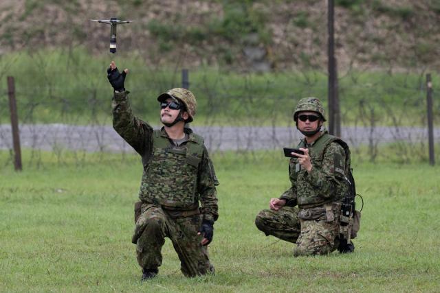 A member of the Japan Ground Self-Defense Force (JGSDF) 6th Division (20th Infantry Regiment) catches a handheld ordnance drone during an exercise covering drone and suppression operations, part of the “Brunet-Takamori 26 (BT26)” Japan-France joint military exercises, at the Ojoji-ga-hara training area near Osaki, Miyagi Prefecture on September 2, 2026. (Photo by ANDREW CABALLERO-REYNOLDS / AFP)