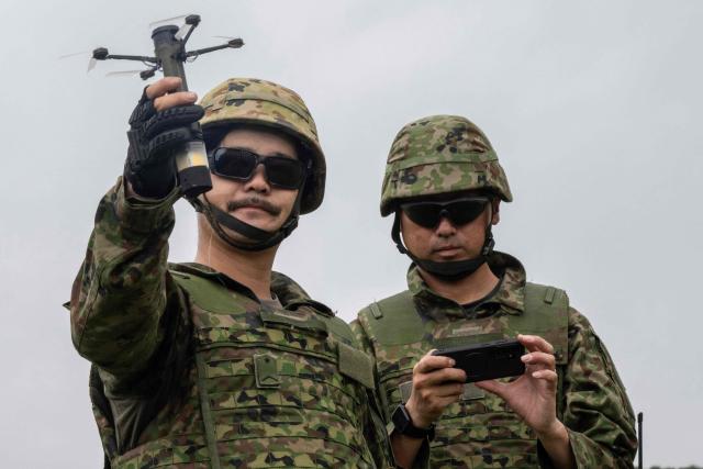 A member of the Japan Ground Self-Defense Force (JGSDF) 6th Division (20th Infantry Regiment) shows off a handheld ordnance drone during an exercise covering drone and suppression operations, part of the “Brunet-Takamori 26 (BT26)” Japan-France joint military exercises, at the Ojoji-ga-hara training area near Osaki, Miyagi Prefecture on September 2, 2026. (Photo by ANDREW CABALLERO-REYNOLDS / AFP)