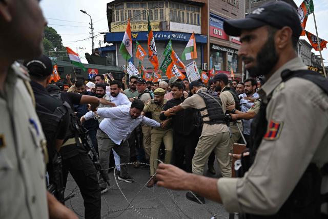 Bharatiya Janata Party (BJP) supporters scuffle with Indian police personnel during a protest against the state government in Srinagar on September 2, 2026. (Photo by TAUSEEF MUSTAFA / AFP)