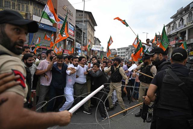 Bharatiya Janata Party (BJP) supporters scuffle with Indian police personnel during a protest against the state government in Srinagar on September 2, 2026. (Photo by TAUSEEF MUSTAFA / AFP)