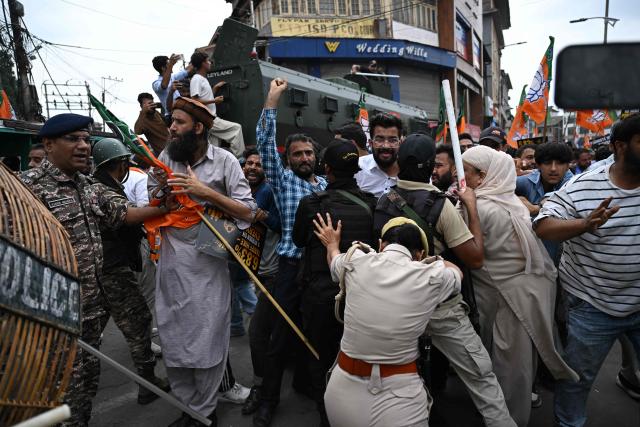 Bharatiya Janata Party (BJP) supporters scuffle with Indian police personnel during a protest against the state government in Srinagar on September 2, 2026. (Photo by TAUSEEF MUSTAFA / AFP)