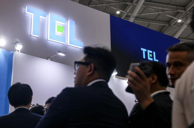 Visitors gather at the Tokyo Electron (TEL) booth during SEMICON Taiwan in Taipei on September 2, 2026. (Photo by I-Hwa Cheng / AFP)
