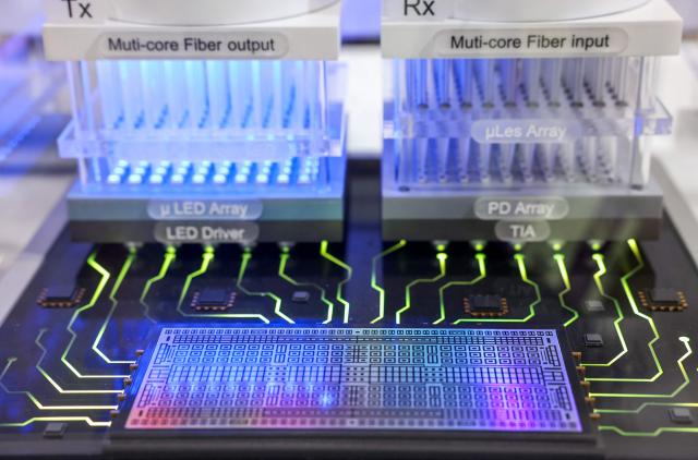 A co-packaged optics demonstration is displayed at the booth of Taiwan's Topco Scientific Co. (TSC) during SEMICON Taiwan in Taipei on September 2, 2026. (Photo by I-Hwa Cheng / AFP)