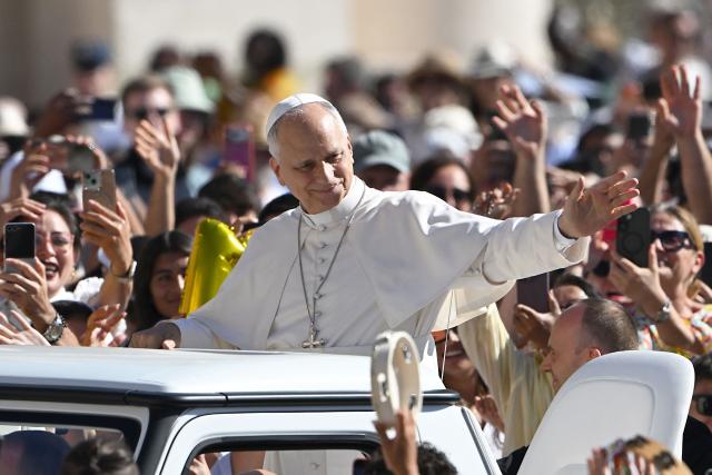 Pope Leo XIV waves to the crowd from his Papamobile during the weekly general audience at St Peter's Square in the Vatican on September 2, 2026. (Photo by Andreas SOLARO / AFP)