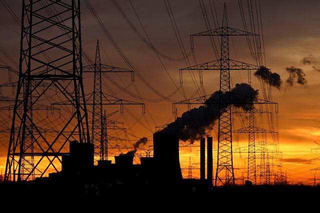 (FILES) This picture taken at sunset on November 12, 2025 shows the lignite-fired power station operated by German energy giant RWE behind electric pylons near Niederaussem, part of Bergheim, western Germany. German police said on September 2, 2026 that they suspected a "deliberate act" damaged an electricity substation, the latest in a string of incidents involving critical infrastructure. The overnight incident in Bergheim in North Rhine-Westphalia state came day after a sabotage attack involving explosives near a power plant southeast of Berlin. (Photo by Ina FASSBENDER / AFP)