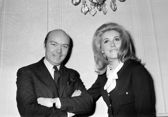 (FILES) French film director Jean-Paul Rappeneau (L) poses with French actress Catherine Deneuve (R) after receiving the Louis Delluc award for his movie "La vie de chateau", in Parison January 15, 1966. French filmmaker Jean-Paul Rappeneau, the multi-César-winning director of eight feature films, including "Cyrano de Bergerac" (1990), died in Paris on September 1, 2026 at the age of 94, one of his sons announced to AFP on September 2, 2026. (Photo by AFP)