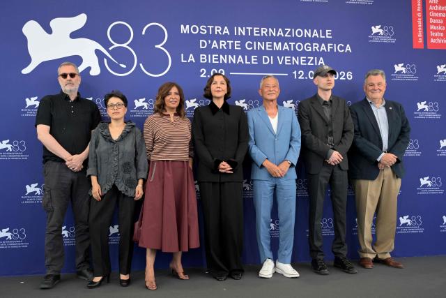 (From L) French director Xavier Giannoli, Afghan director and actress Shahrbanoo Sadat, Tunisian director Kaouther Ben Hania, US actress Maggie Gyllenhaal (President), US producer and director Johnny To, British composer Daniel Blumberg and Francesco Casetti attend the photocall of the jury of the 83rd International Venice Film Festival, at Venice Lido on September 2, 2026. (Photo by Tiziana FABI / AFP)