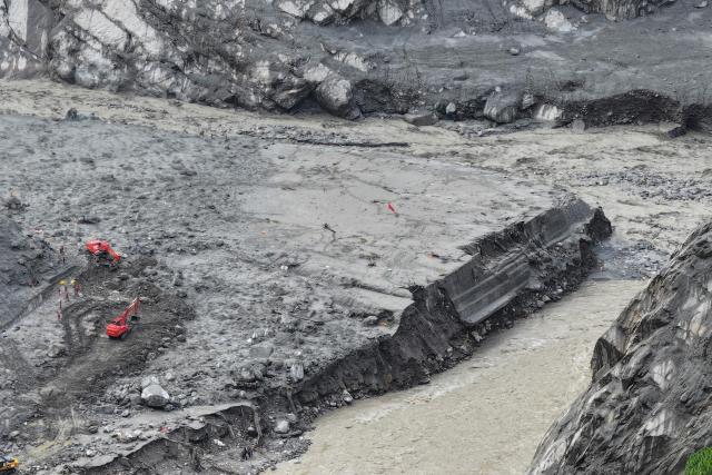 This aerial photo shows rescuers at the site of the Gyirong Port, which was destroyed by a mudslide on August 26, in Gyirong County, in China’s western Tibet region on September 2, 2026. (Photo by CNS / AFP) / China OUT