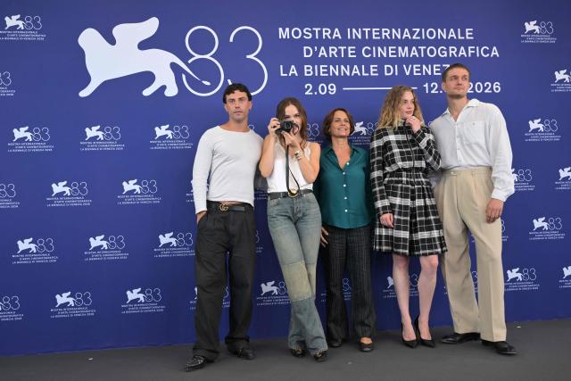 (From L) Actor Aaron Altaras, German actress Emilia Schule, director Alina Marazzi, Swiss actress Luna Wedler and Austrian actor Lucas Englander attend the photocall of the movie "The Girl with the Leica" (La ragazza con la Leica) presented in the Orizzonti selection at the 83rd International Venice Film Festival, at Venice Lido on September 2, 2026. (Photo by Tiziana FABI / AFP)