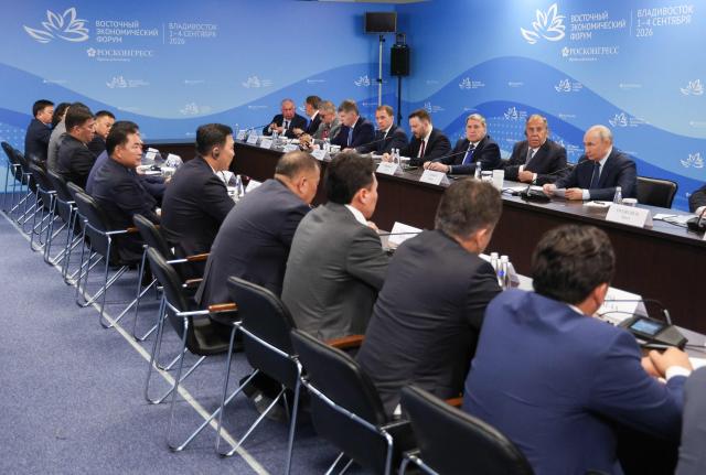 In this pool photograph distributed by the Russian state agency Sputnik, Russia's President Vladimir Putin meets with Mongolia's Prime Minister Nyam-Osor Uchral on the sidelines of the Eastern Economic Forum in Vladivostok on September 2, 2026. (Photo by Vyacheslav PROKOFYEV / POOL / AFP)