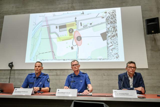 (From L) Head of Operations in Aargau Canton Police Matthias Schildknecht, Aargau Canton Police Commander Michael Leupold and Lenzburg-Aarau District Attorney's Office head Christoph Ruedi attend a press conference following a shooting at a rave party in Aarau, in Schafisheim, northern Switzerland on September 2, 2026. A 43-year-old Swiss man was arrested on August 2, 2026 on "strong suspicion" of being behind a rare deadly gun attack at a rave in Switzerland, police said. The attack triggered an international manhunt for the shooter, who left an Italian woman dead and wounded five others, some seriously. (Photo by Fabrice COFFRINI / AFP)