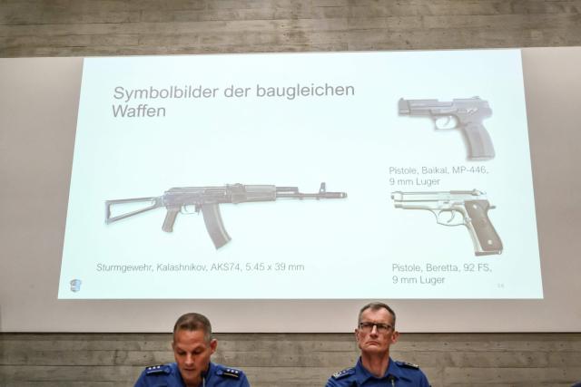 This photograph shows file photos of weapons identical to those used in the shooting displayed on a screen during a press conference following a shooting at a rave party in Aarau, in Schafisheim, northern Switzerland on September 2, 2026. A 43-year-old Swiss man was arrested on August 2, 2026 on "strong suspicion" of being behind a rare deadly gun attack at a rave in Switzerland, police said. The attack triggered an international manhunt for the shooter, who left an Italian woman dead and wounded five others, some seriously. (Photo by Fabrice COFFRINI / AFP)