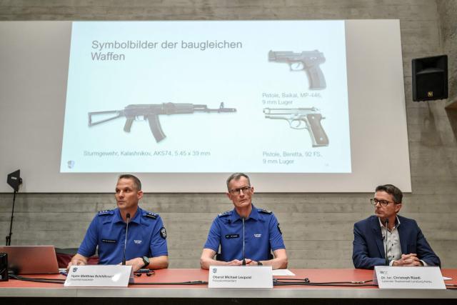(From L) Head of Operations in Aargau Canton Police Matthias Schildknecht, Aargau Canton Police Commander Michael Leupold and Lenzburg-Aarau District Attorney's Office head Christoph Ruedi attend a press conference beneath a screen showing file photos of weapons identical to those used in the shooting following a shooting at a rave party in Aarau, in Schafisheim, northern Switzerland on September 2, 2026. A 43-year-old Swiss man was arrested on August 2, 2026 on "strong suspicion" of being behind a rare deadly gun attack at a rave in Switzerland, police said. The attack triggered an international manhunt for the shooter, who left an Italian woman dead and wounded five others, some seriously. (Photo by Fabrice COFFRINI / AFP)