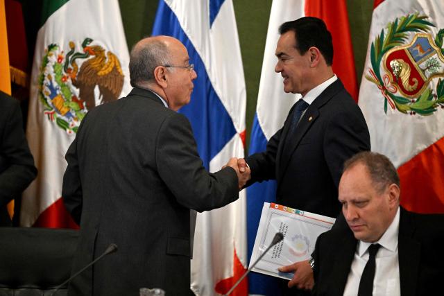 Brazil's Foreign Minister Mauro Vieira (L) and Paraguay's Foreign Minister Ruben Ramirez Lezcano (R) greet during the 20th Meeting of the Council of Foreign Ministers at the Latin American Integration Association (ALADI) headquarters in Montevideo on September 2, 2026. (Photo by Eitan ABRAMOVICH / AFP)