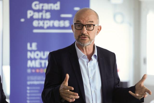 President of the executive board of the "Societe des grands projets" Jean-François Monteils delivers remarks during a press conference at the building site of the Grand Paris Express La Folie station in Nanterre on September 2, 2026. (Photo by Thomas SAMSON / AFP)