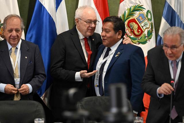 Uruguay's Foreign Minister Mario Lubetkin (C) and Bolivia's Foreign Minister Hector Huanca (2nd-R) talk next to outgoing ALADI president Uruguayan Sergio Abreu (L) during the 20th Meeting of the Council of Foreign Ministers at the Latin American Integration Association (ALADI) headquarters in Montevideo on September 2, 2026. (Photo by Eitan ABRAMOVICH / AFP)
