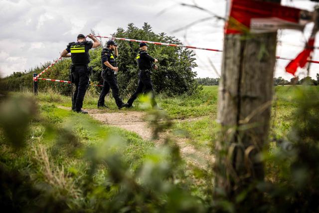 Netherlands' Police Mobile Unit conducts a search in a field, a day after a shooting incident, resulting in the death of a 51-year-old, reportedly a security guard, in Overasselt, southeastern Netherlands on September 2, 2026. Dutch authorities said on September 1 they had arrested 34 people, including French, Belgian and Algerian nationals, after a pre-dawn shootout reportedly linked to a notorious drug lord that claimed one life. (Photo by ROB ENGELAAR / ANP / AFP) / Netherlands OUT