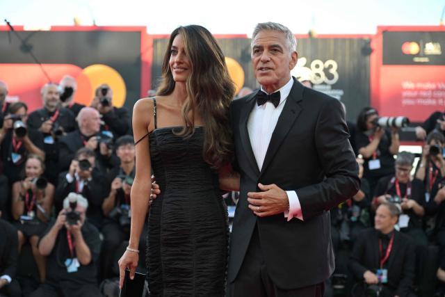 Lawyer Amal Clooney and US actor George Clooney, attend the red carpet event ahead the screening of "Hink" and the Opening ceremony of the 83rd International Venice Film Festival, at Venice Lido on September 2, 2026. (Photo by Tiziana FABI / AFP)