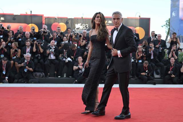 Lawyer Amal Clooney and US actor George Clooney, attend the red carpet event ahead the screening of "Hink" and the Opening ceremony of the 83rd International Venice Film Festival, at Venice Lido on September 2, 2026. (Photo by Tiziana FABI / AFP)