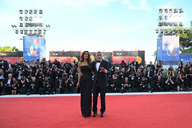 Lawyer Amal Clooney and US actor George Clooney, attend the red carpet event ahead the screening of "Hink" and the Opening ceremony of the 83rd International Venice Film Festival, at Venice Lido on September 2, 2026. (Photo by Tiziana FABI / AFP)