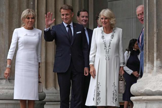 Britain's King Charles III (R) and Britain's Queen Camilla (2R) stand with France's President Emmanuel Macron (2L) and his wife Brigitte Macron, as they arrive at British Museum in London on September 2, 2026, to attend a preview event for the Bayeux Tapestry Exhibition. (Photo by CARLOS JASSO / AFP)