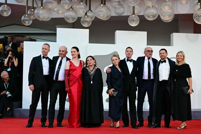 Director Danny Boyle (3rdR) pose with the cast of his movie "Hink", British actor Jack O’Connell, Guy Pearce and Claire Foy and producers during the red carpet event of the Opening ceremony of the 83rd International Venice Film Festival, at Venice Lido on September 2, 2026. (Photo by Stefano Rellandini / AFP)
