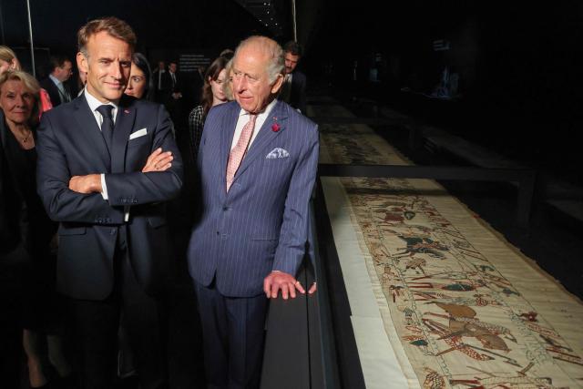 Britain's King Charles III (R) and France's President Emmanuel Macron (front L) attend a preview event for the Bayeux Tapestry Exhibition, at the British Museum in London on September 2, 2026. (Photo by Ludovic MARIN / POOL / AFP)