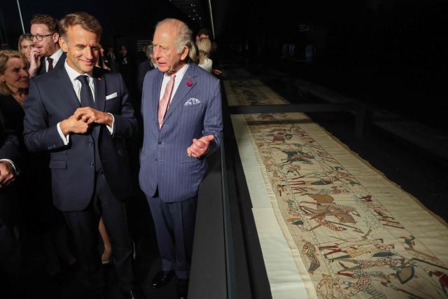 Britain's King Charles III (R) and France's President Emmanuel Macron (front L) attend a preview event for the Bayeux Tapestry Exhibition, at the British Museum in London on September 2, 2026. (Photo by Ludovic MARIN / POOL / AFP)